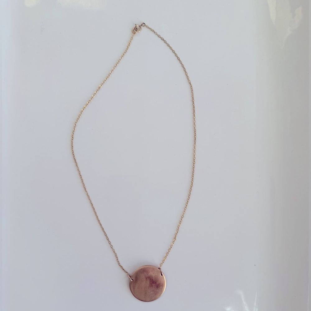 Gold-filled disc pendant with side links. 17”.